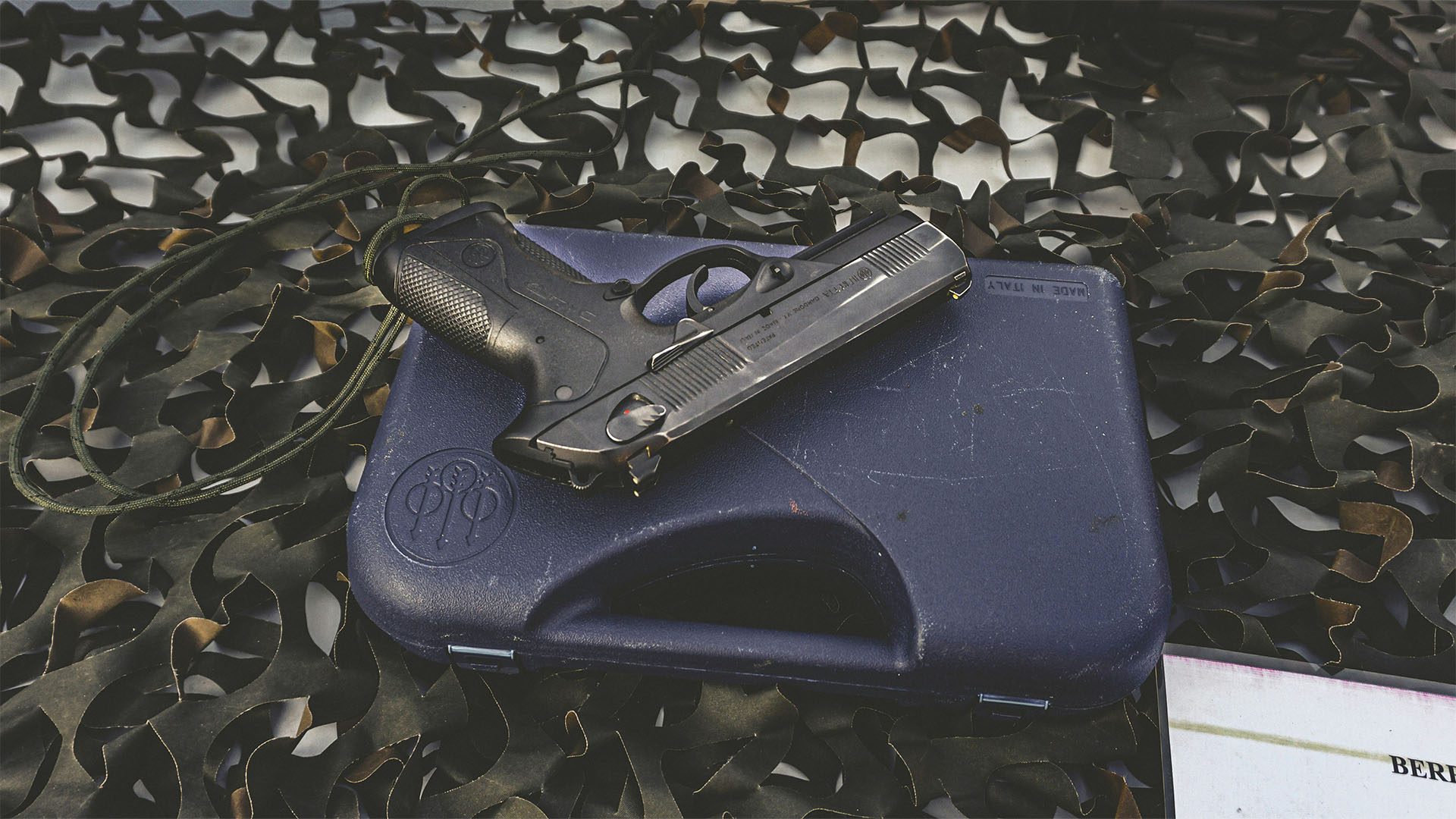 Handgun lying on a blue case