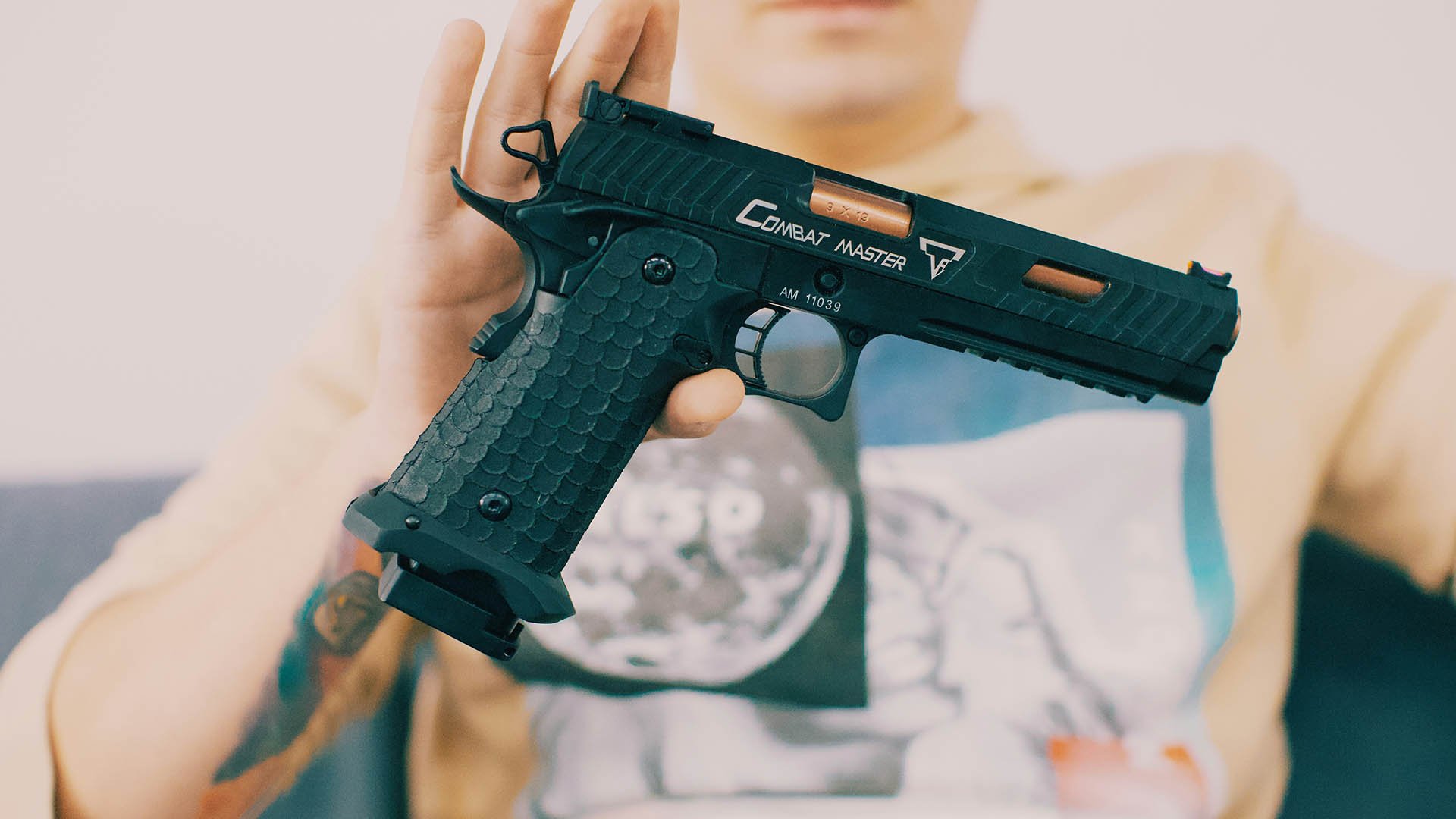 Man displaying a handgun in his hand