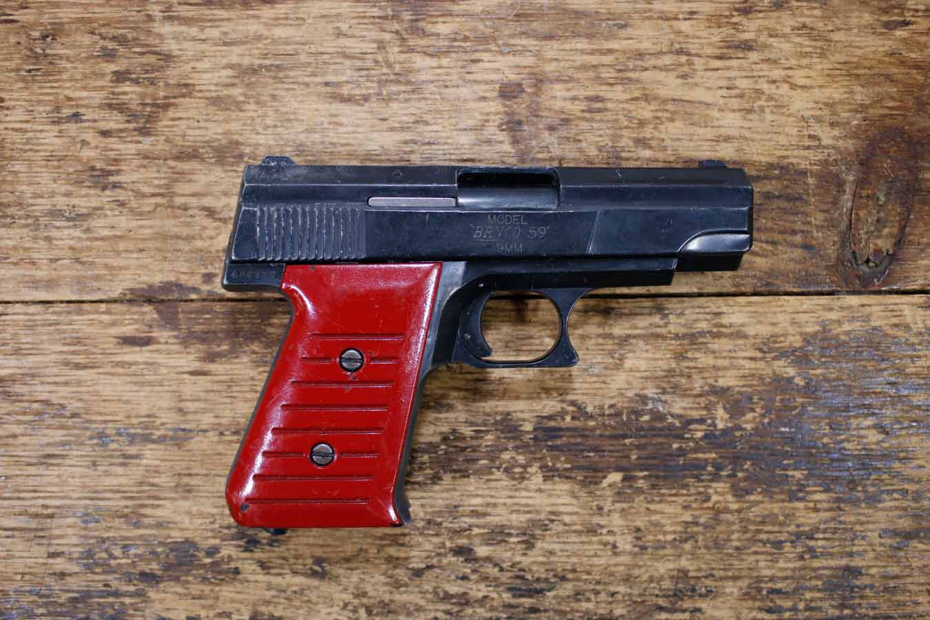 Bryco 59 9mm Police Trade-In Pistol with Red Grips (Magazine Not Included)