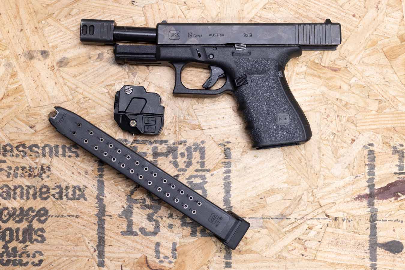 GLOCK 19 Gen4 9mm Police Trade-In Pistol with Extended Mag, Light, Threaded Barrel and Compensator