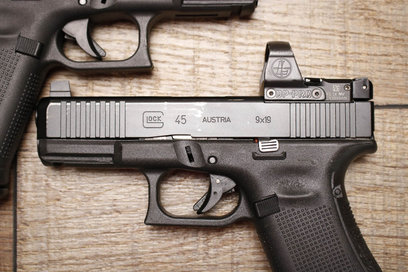 GLOCK 45 9mm Police Trade-In Pistol with Night Sights and Leupold Delta Point Pro Red Dot (Fair Condition)